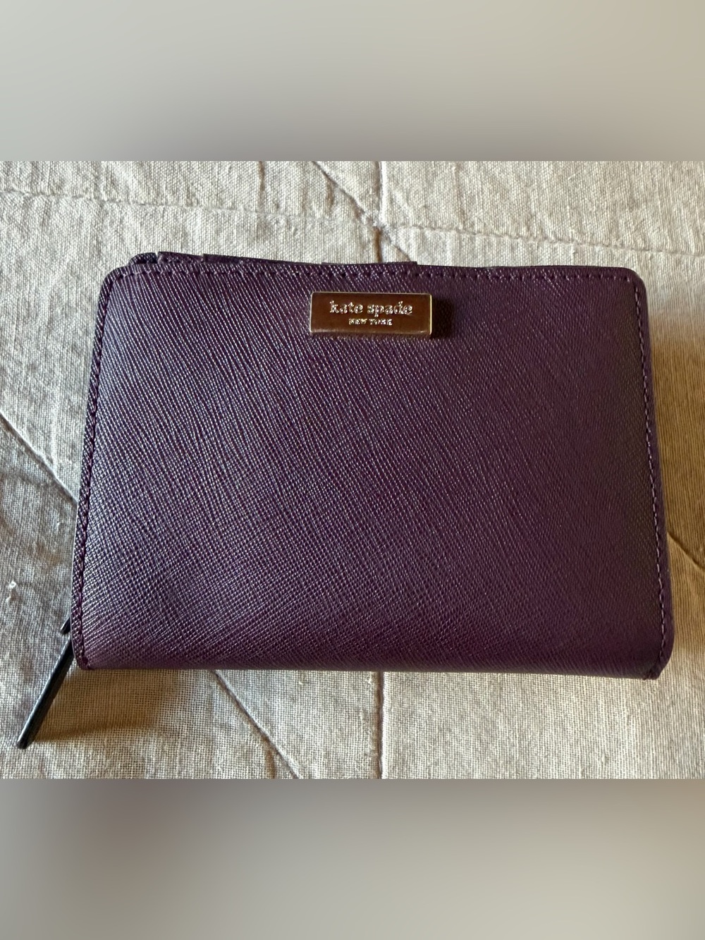 kate spade plum zip-around wallet with gold plaque